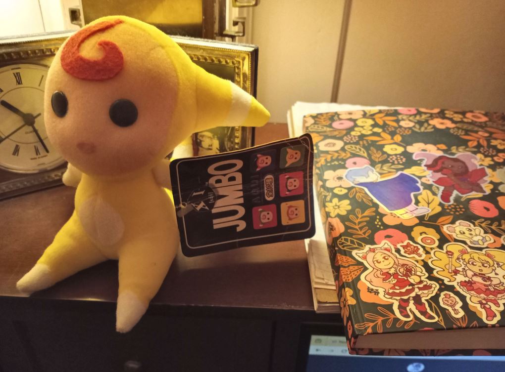 yellow aqui plush on my desk