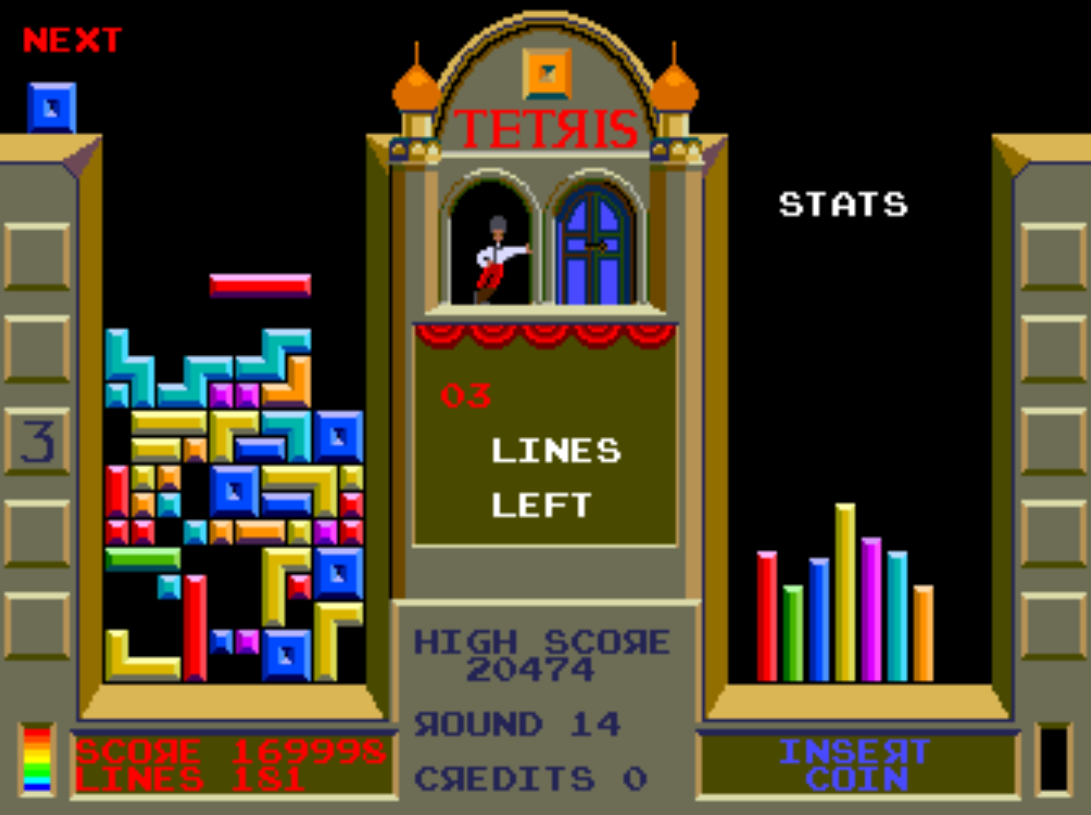 atari tetris gameplay. the dancer is leaning on the window and watching.